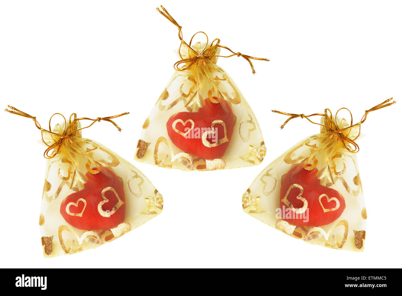 Amour rouge Coeur en sachets d'or sur fond blanc Banque D'Images