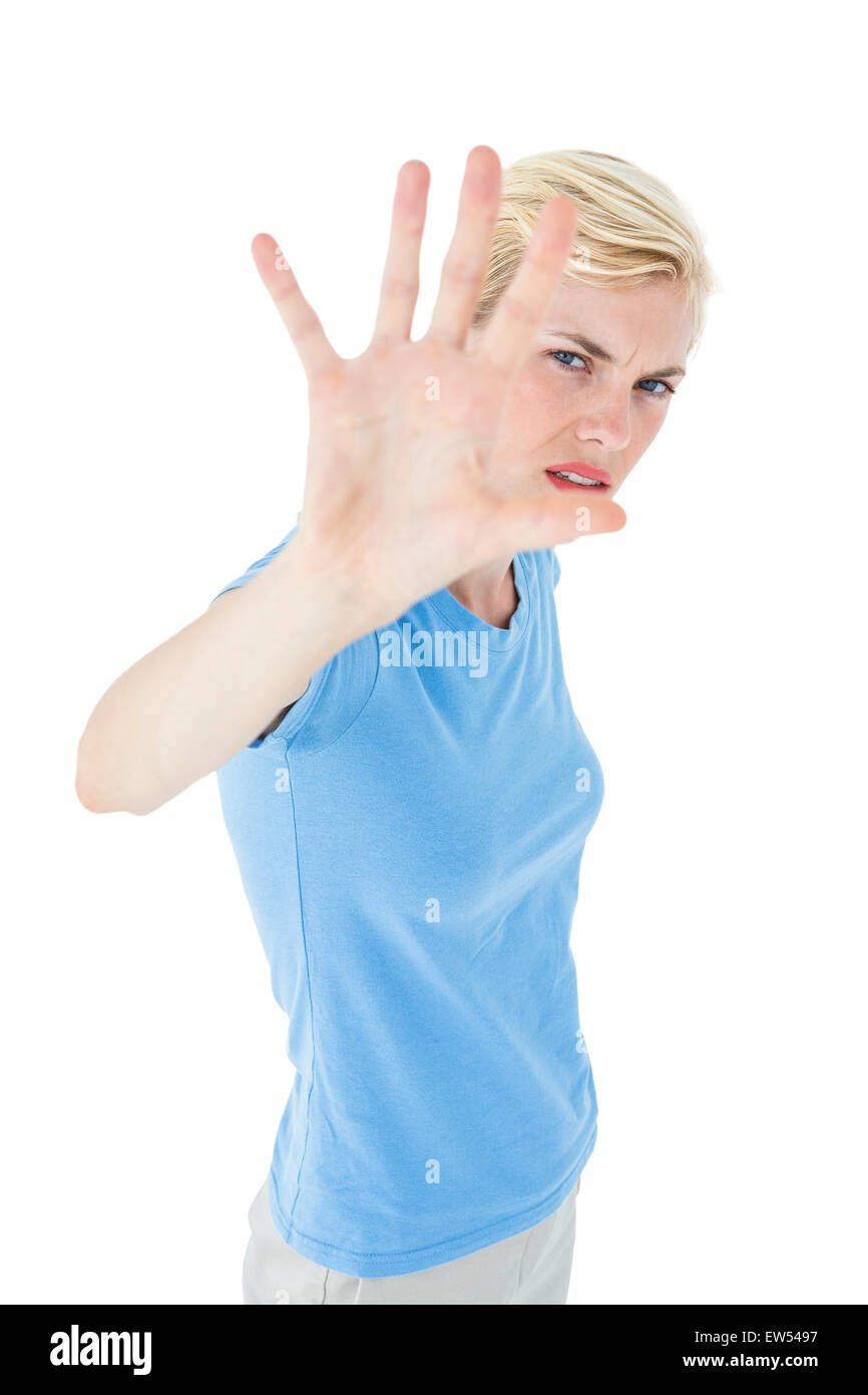 Stern woman gesturing with her hand Banque D'Images