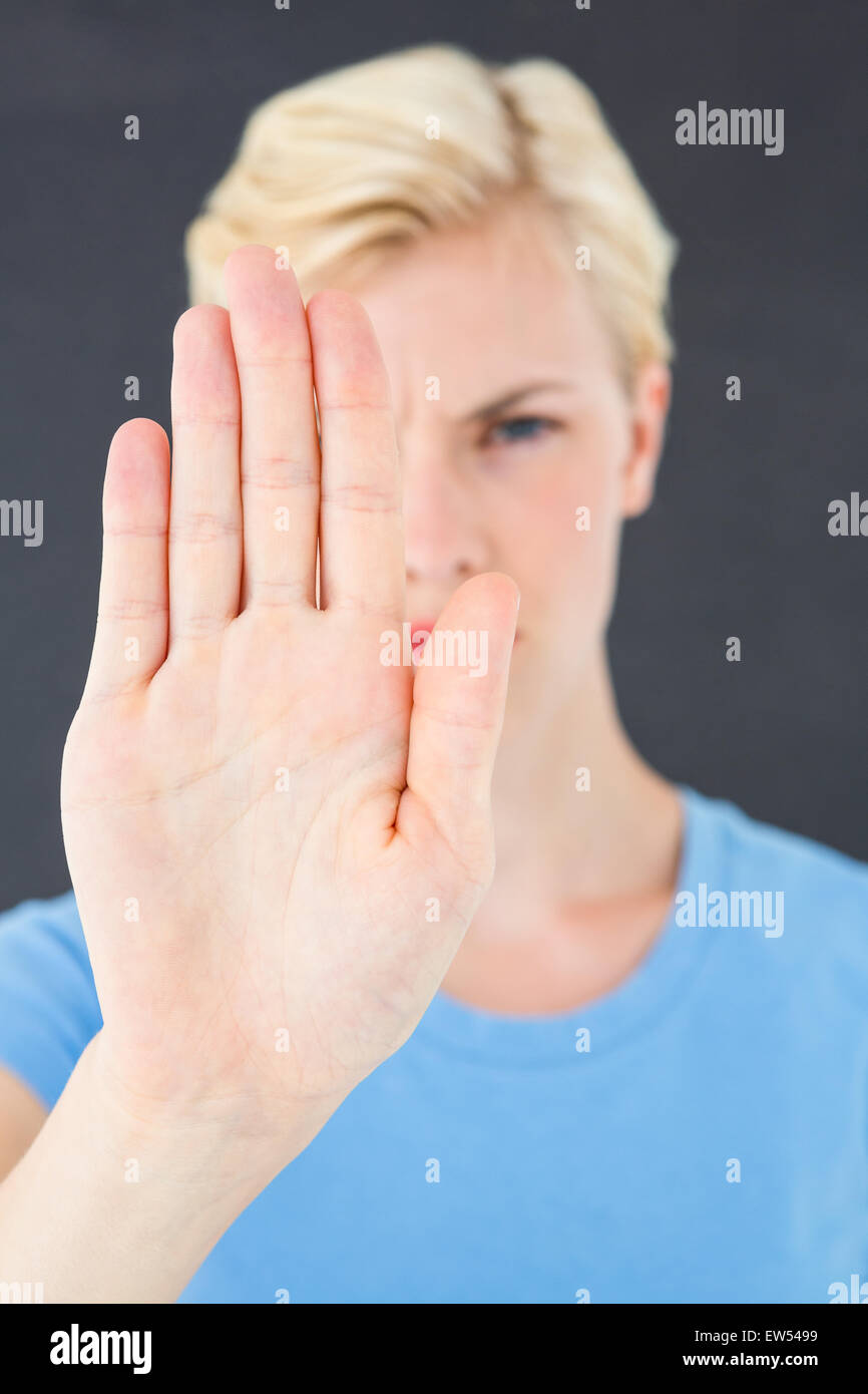 Stern woman gesturing with her hand Banque D'Images