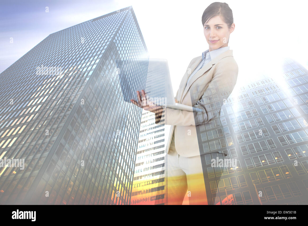 Composite image young businesswoman with laptop Banque D'Images