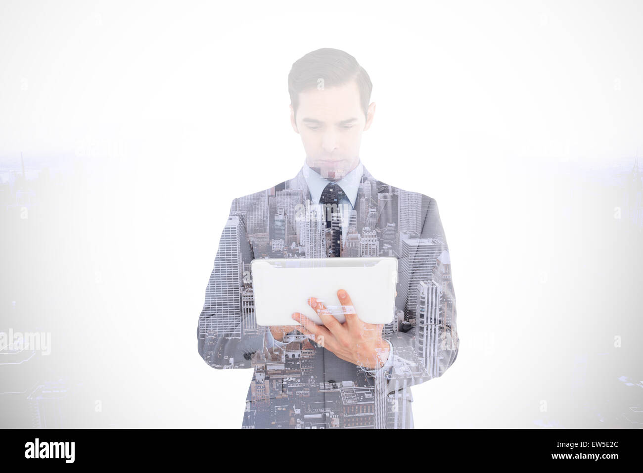 Composite image of businessman holding a tablet computer Banque D'Images