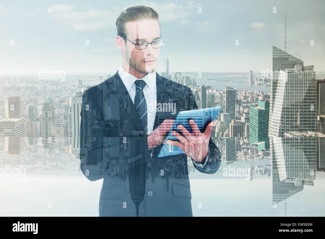Composite image of businessman using tablet pc Banque D'Images