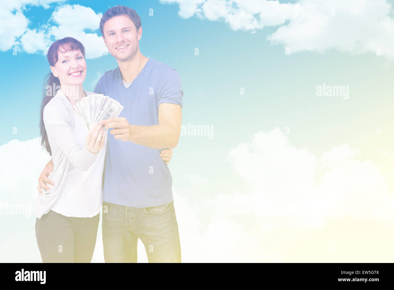 Image composite du couple holding fan de paiement Banque D'Images