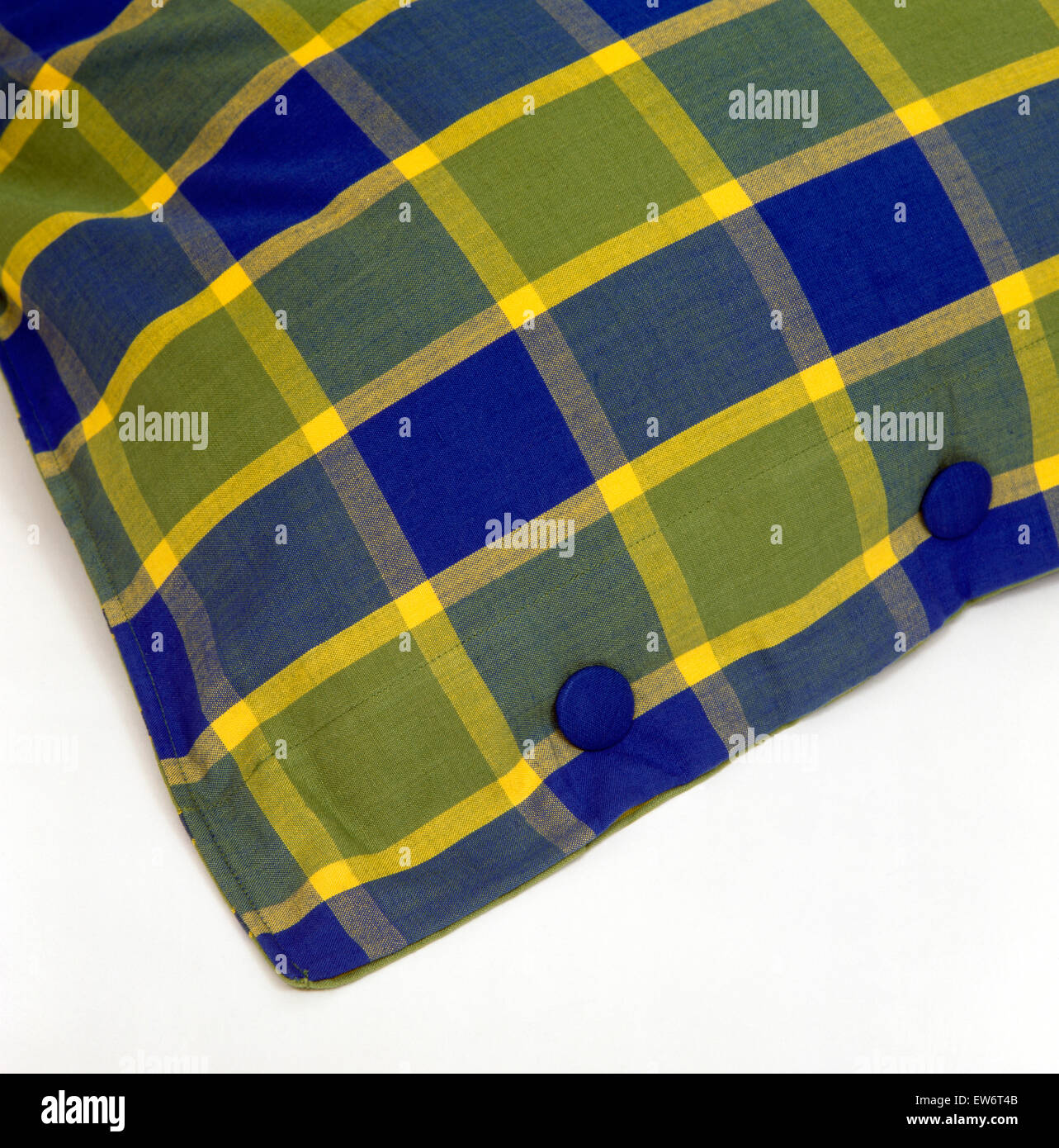 Close-up d'un coussin vert +bleu boutonnée Banque D'Images