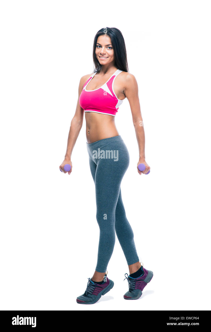 Portrait of a happy woman holding dumbbells fitness isolé sur un fond blanc. Looking at camera Banque D'Images Portrait of a happy woman holding dumbbells fitness isolé sur un fond blanc. Looking at camera Banque D'Images
