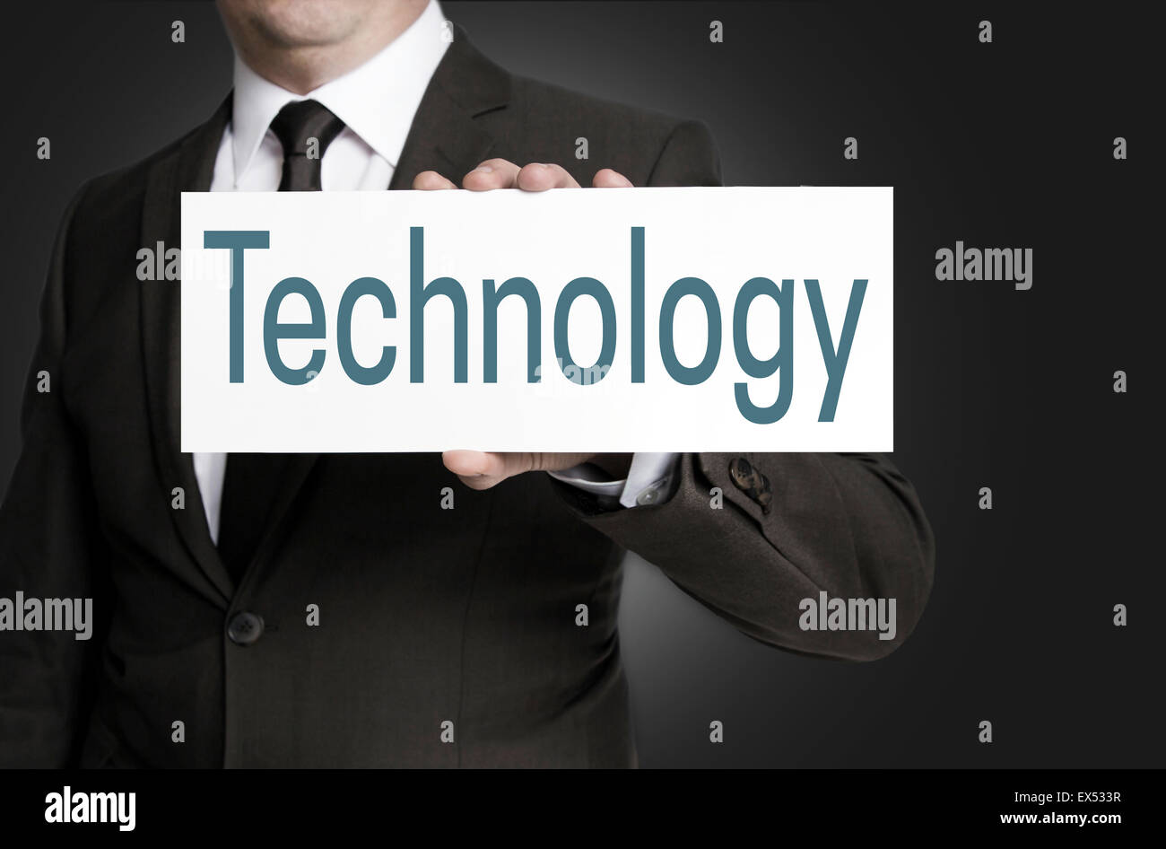 Signe de la technologie est tenu par l'homme d'affaires. Banque D'Images