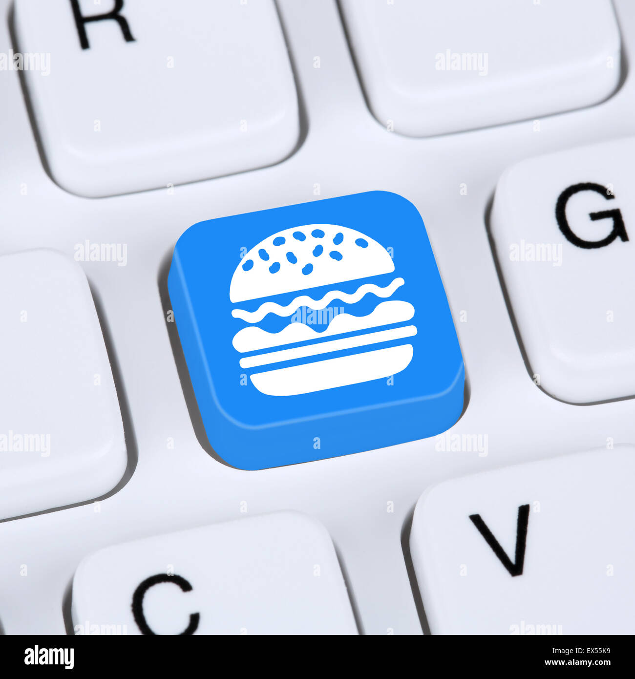 Cheeseburger Hamburger Computer concept restauration rapide livraison de commande en ligne commande concept internet Banque D'Images