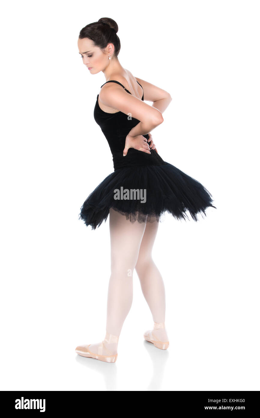 Belle femme ballerine isolé sur un fond blanc. Ballerine est vêtu d'un justaucorps noir, bas rose, pointe de la chaussure Banque D'Images