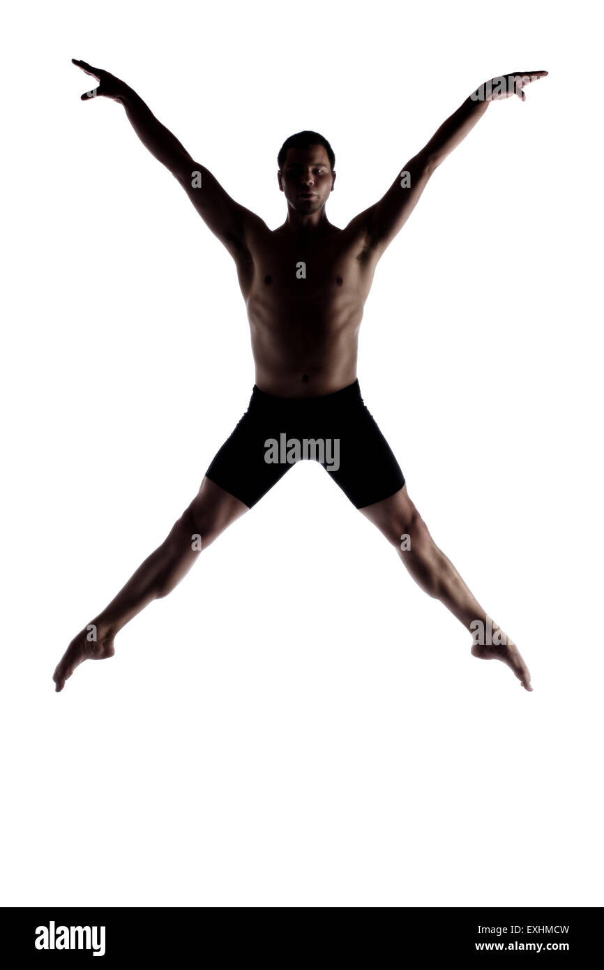 Silhouette d'un homme adulte musculaire style contemporain moderne danseuse de ballet. Danseur est vêtu de noir pantalon de ski et est isolé Banque D'Images