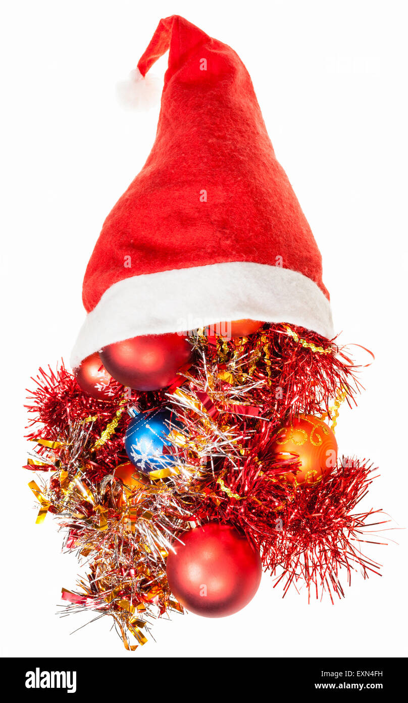 Cadeaux de Noël - décorations de Noël Boules et étendre au chapeau de Père Noël rouge sur fond blanc Banque D'Images