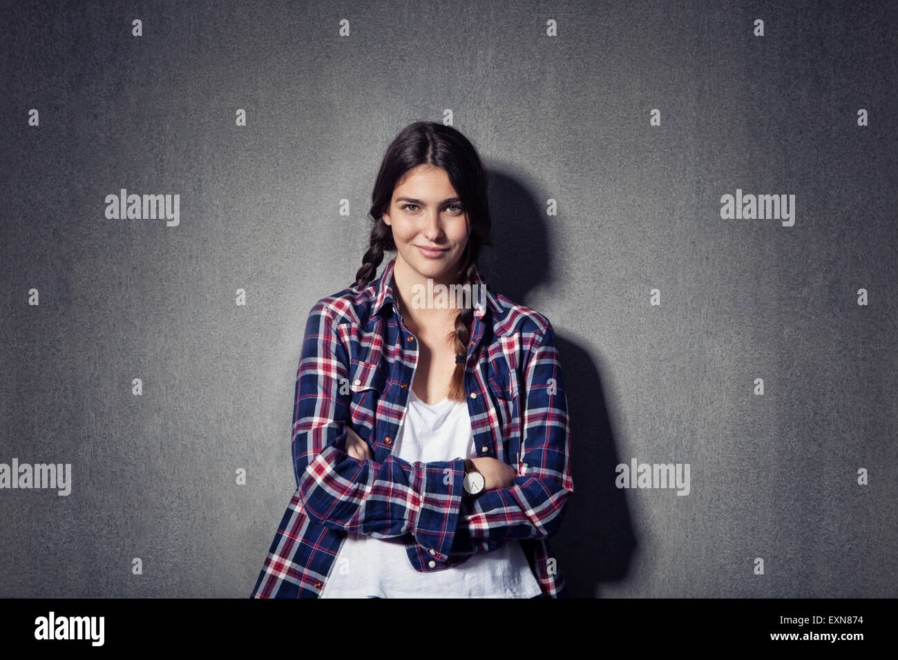 Portrait of smiling young woman with braids Banque D'Images