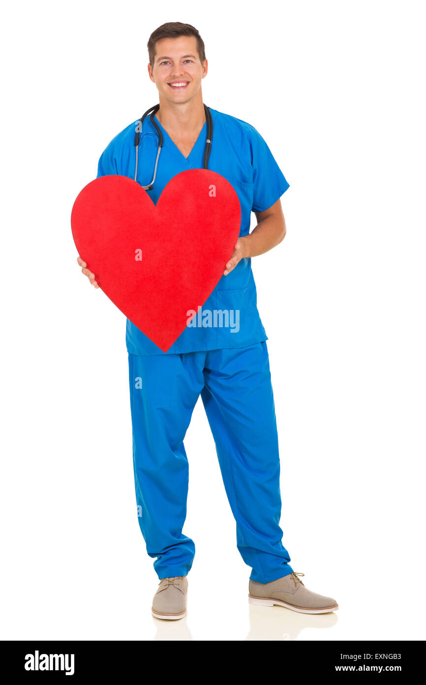 Young doctor holding heart shape on white background Banque D'Images