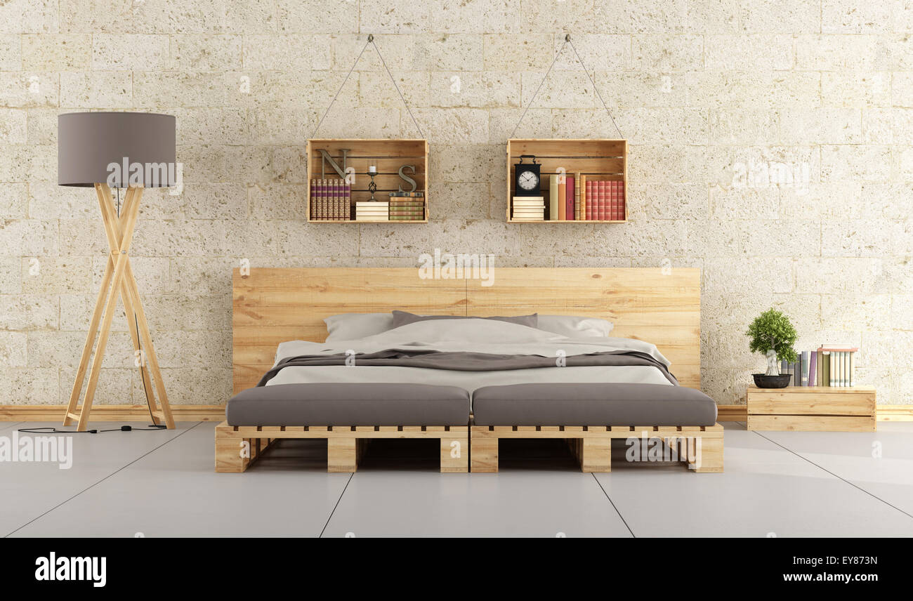 Chambre à coucher moderne avec lit double palette sur mur de brique Photo  Stock - Alamy