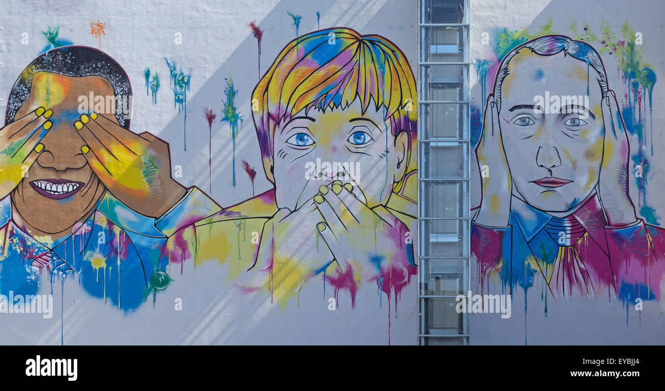 Barack Obama, Angela Merkel, Vladimir Poutine , street art mural sur la construction Banque D'Images