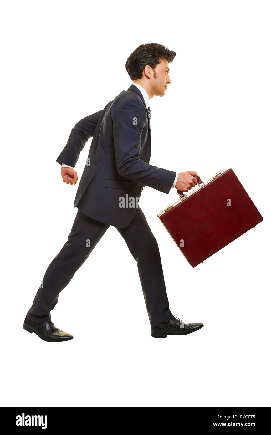 Business man walking de profil avec un porte-documents Banque D'Images