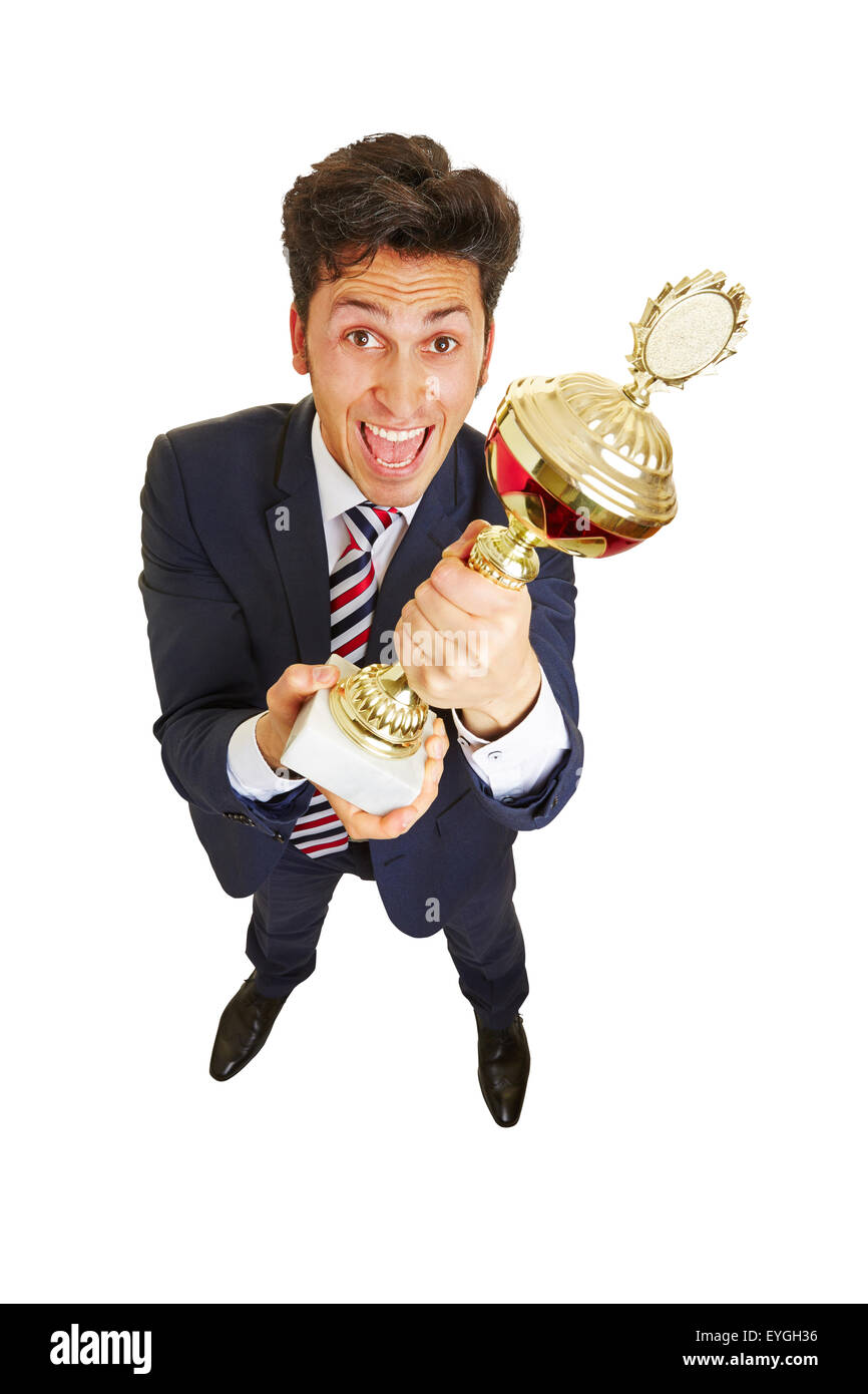 L'homme d'affaires d'encouragement avec un gros trophée dans ses mains Banque D'Images
