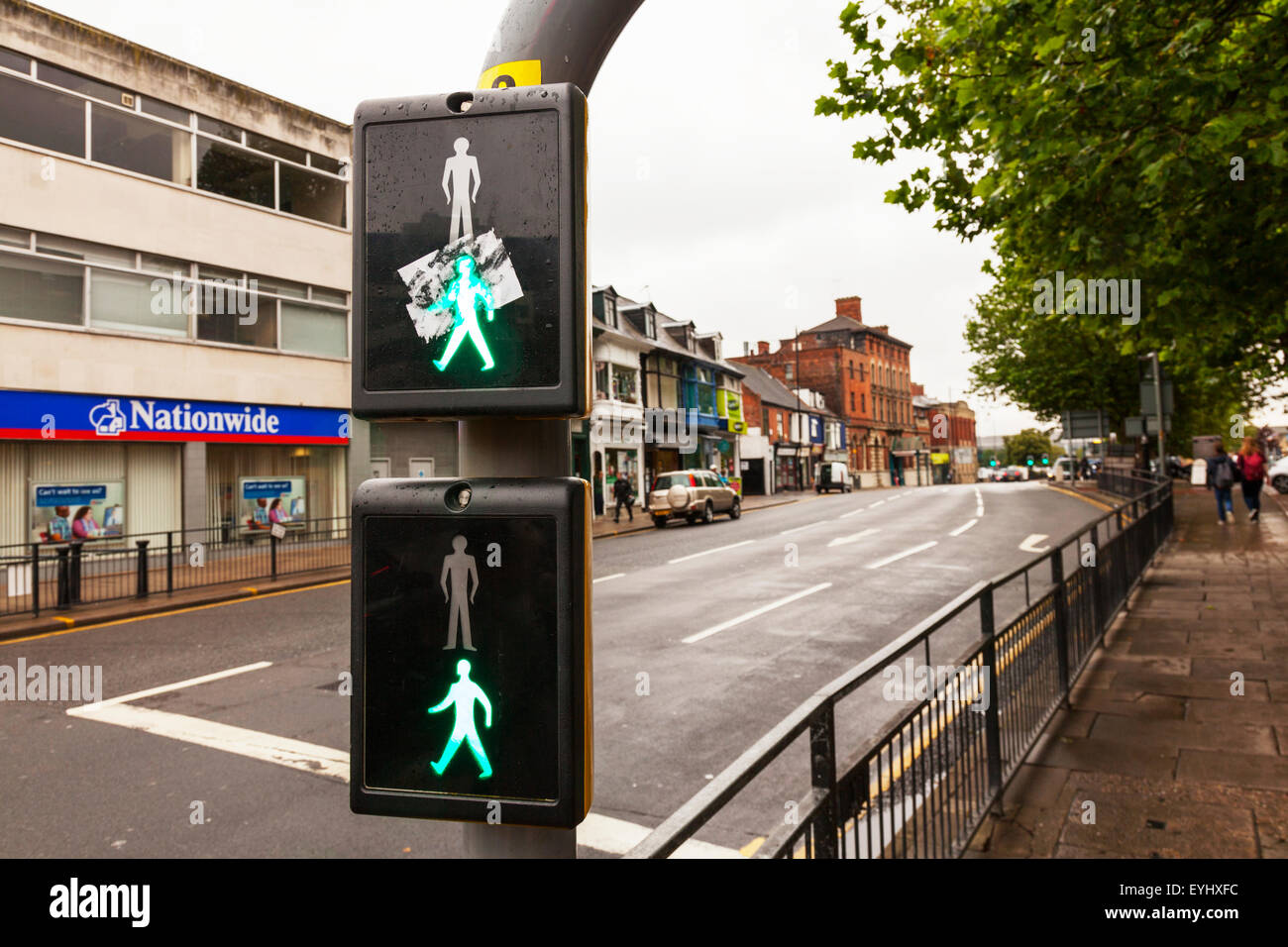 Passage pour piétons voyant vert allumé l'homme signifie traverser en toute sécurité la sécurité aux passages à niveau de la ville de Lincoln Lincolnshire UK Angleterre Banque D'Images