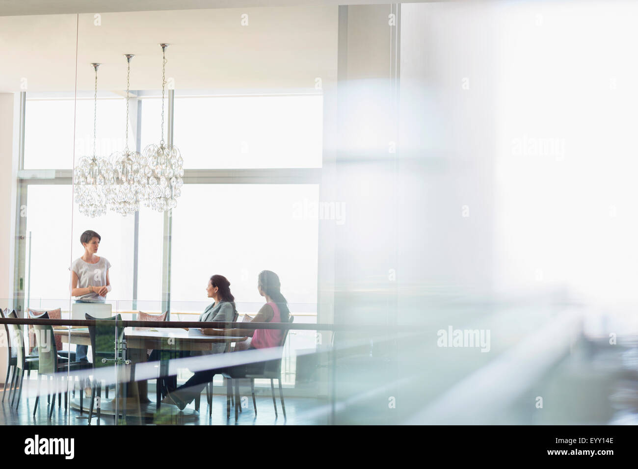 Businesswomen talking in conference room Banque D'Images