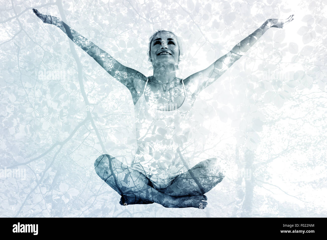 Image composite de tonique young woman with arms outstretched Banque D'Images