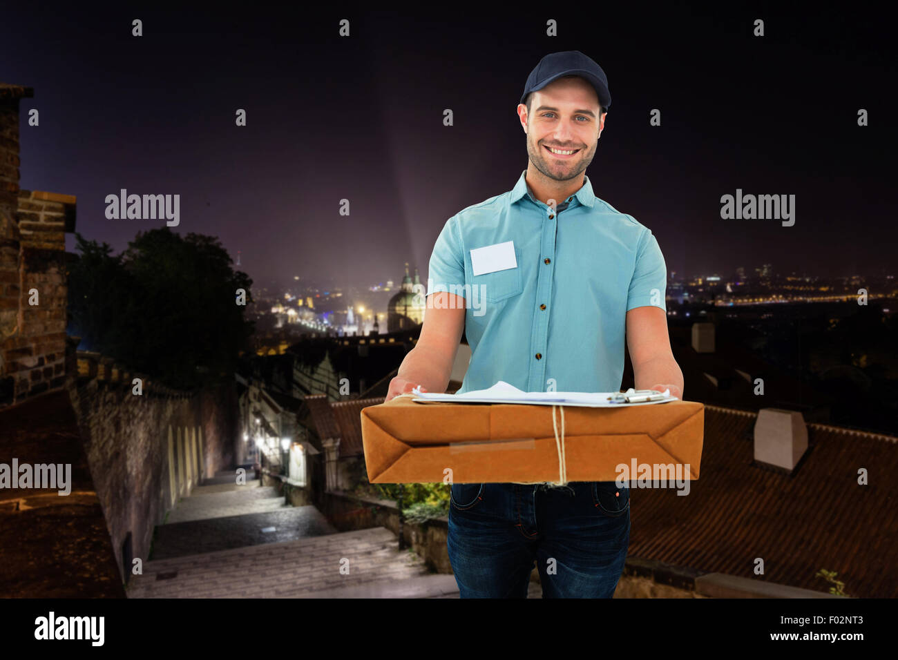 Composite image of handsome man with parcel courier Banque D'Images