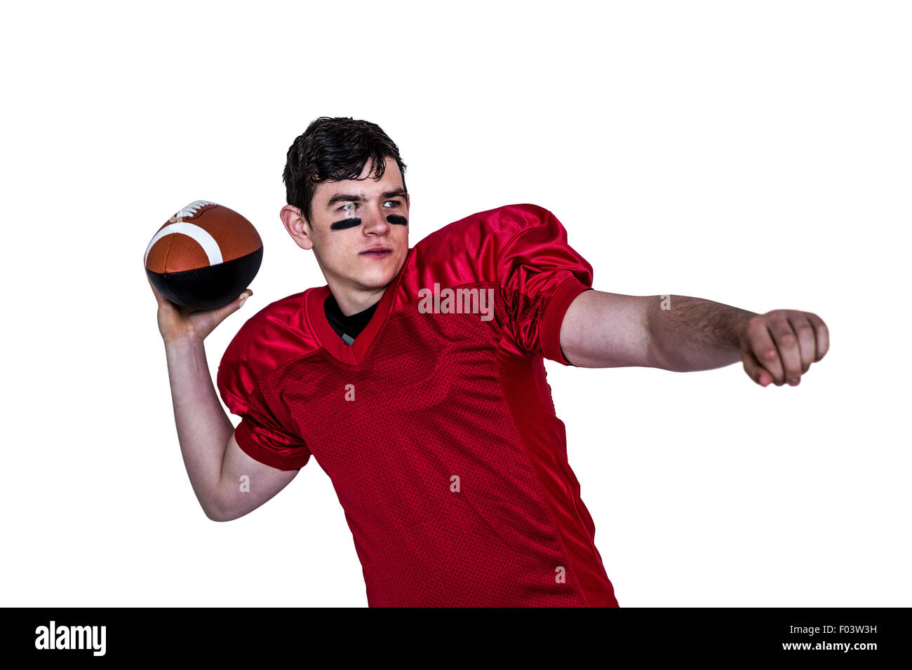 Joueur de football américain lançant une boule Banque D'Images