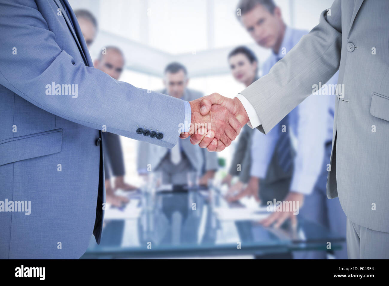 Composite image shaking hands Banque D'Images