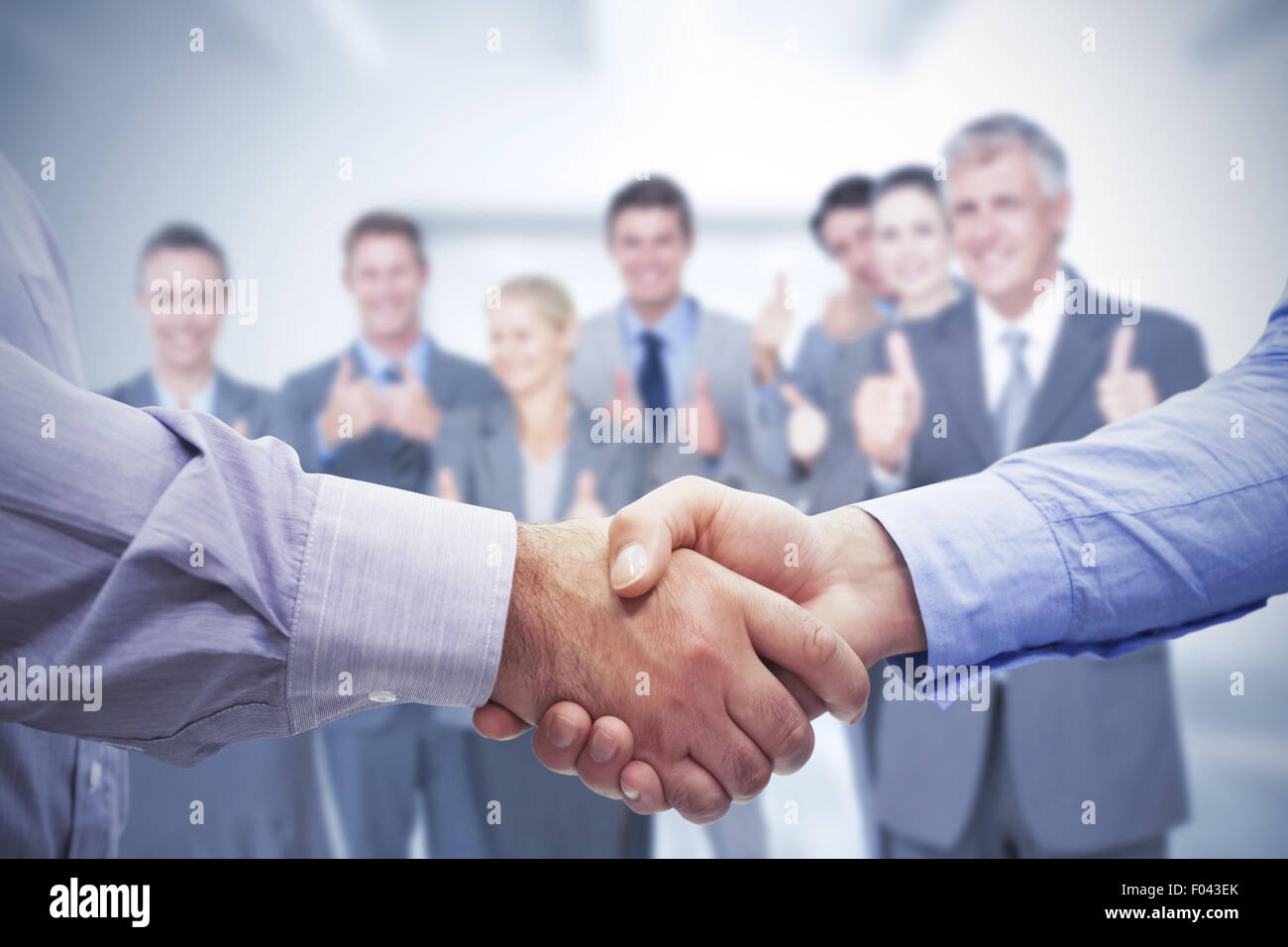 Image composite de men shaking hands Banque D'Images