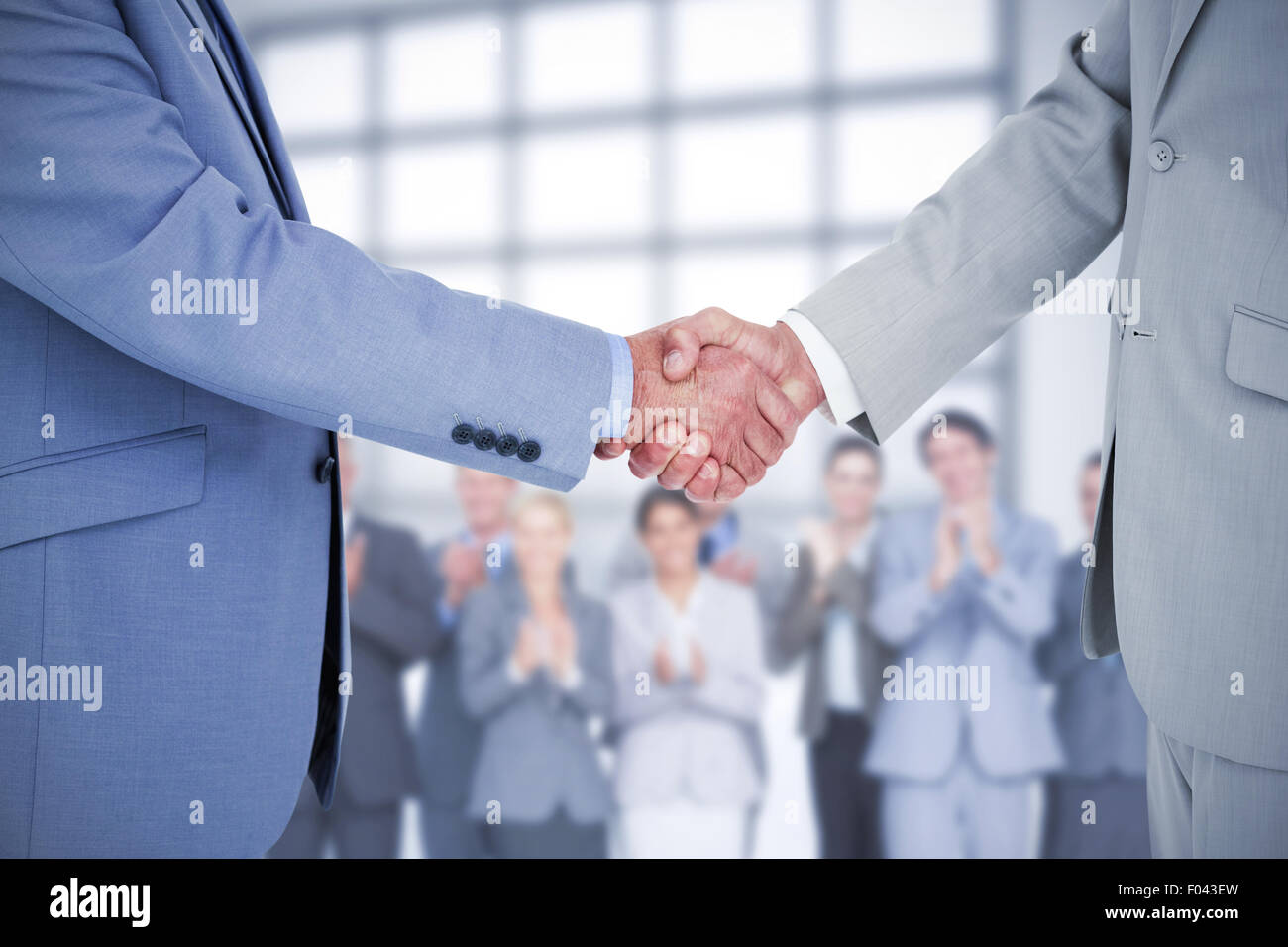 Composite image shaking hands Banque D'Images