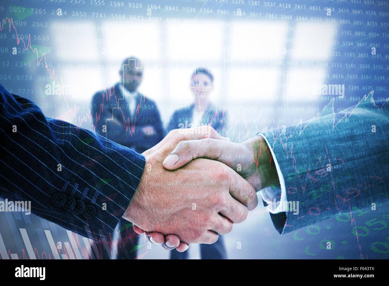 Image composite de business people shaking hands Banque D'Images