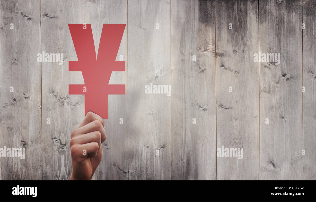 Image composite de hand holding yen sign Banque D'Images