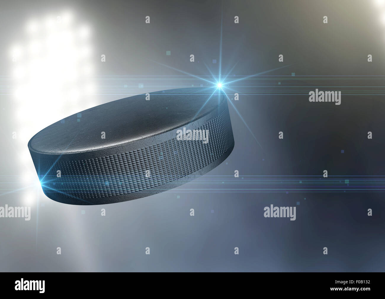 Une rondelle de hockey sur glace ordinaire volant par l'air sur un arrière-plan d'un stade en plein air pendant la nuit Banque D'Images