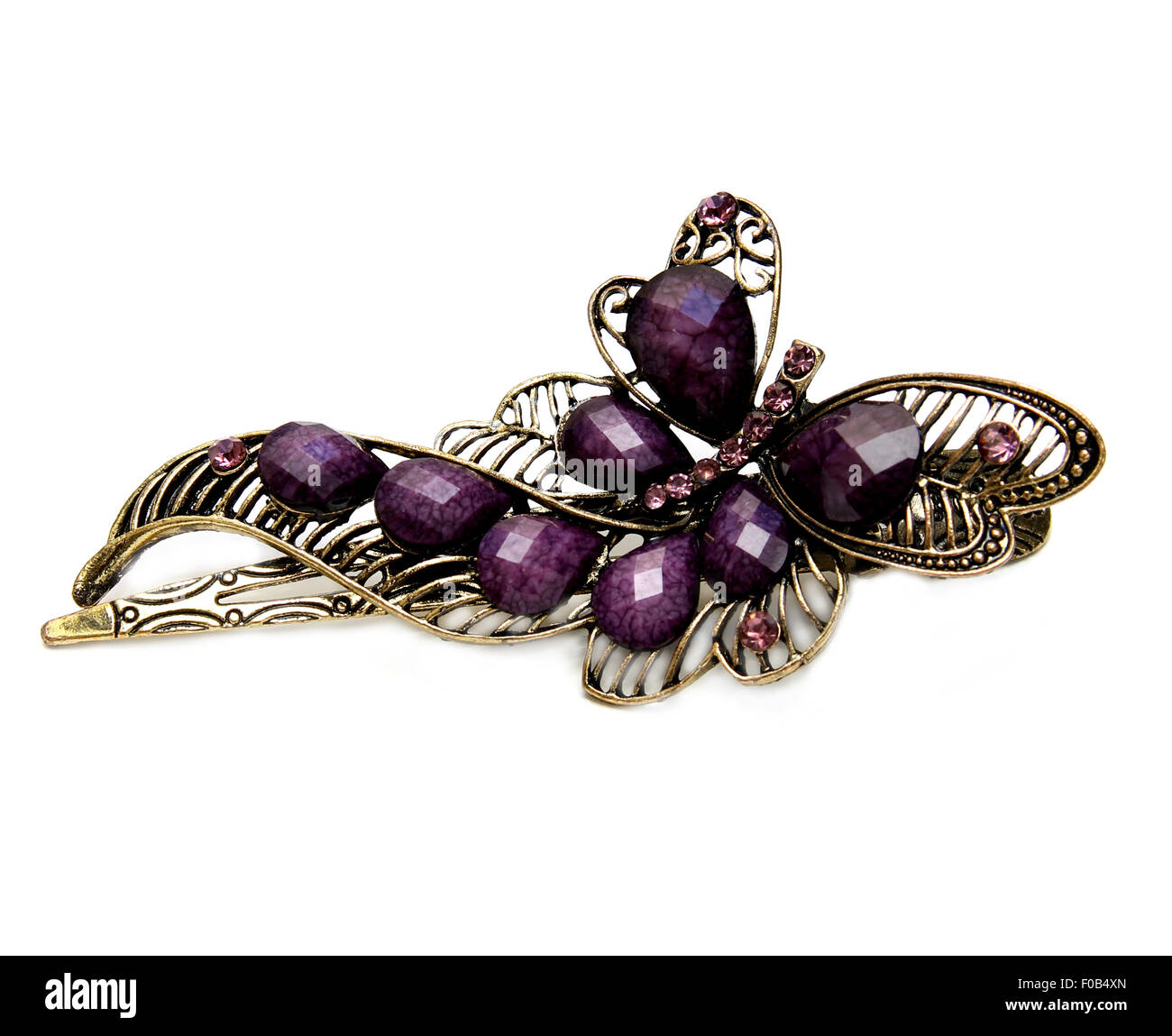 Metal magnifique pince à cheveux violet avec de grosses pierres, en fond blanc Banque D'Images