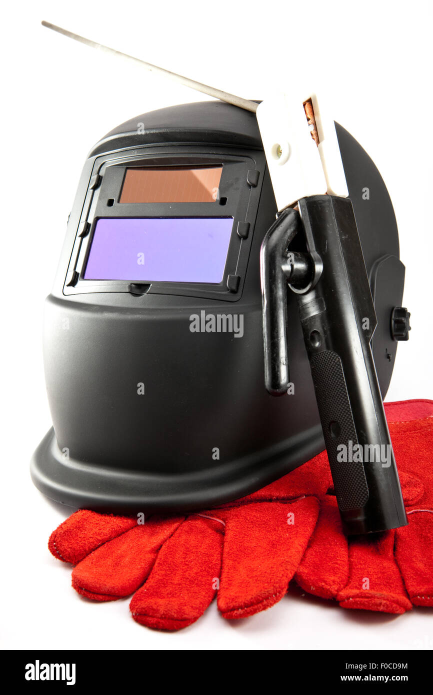 Masque de protection du soudeur, électrodes et des gants sur fond blanc Banque D'Images