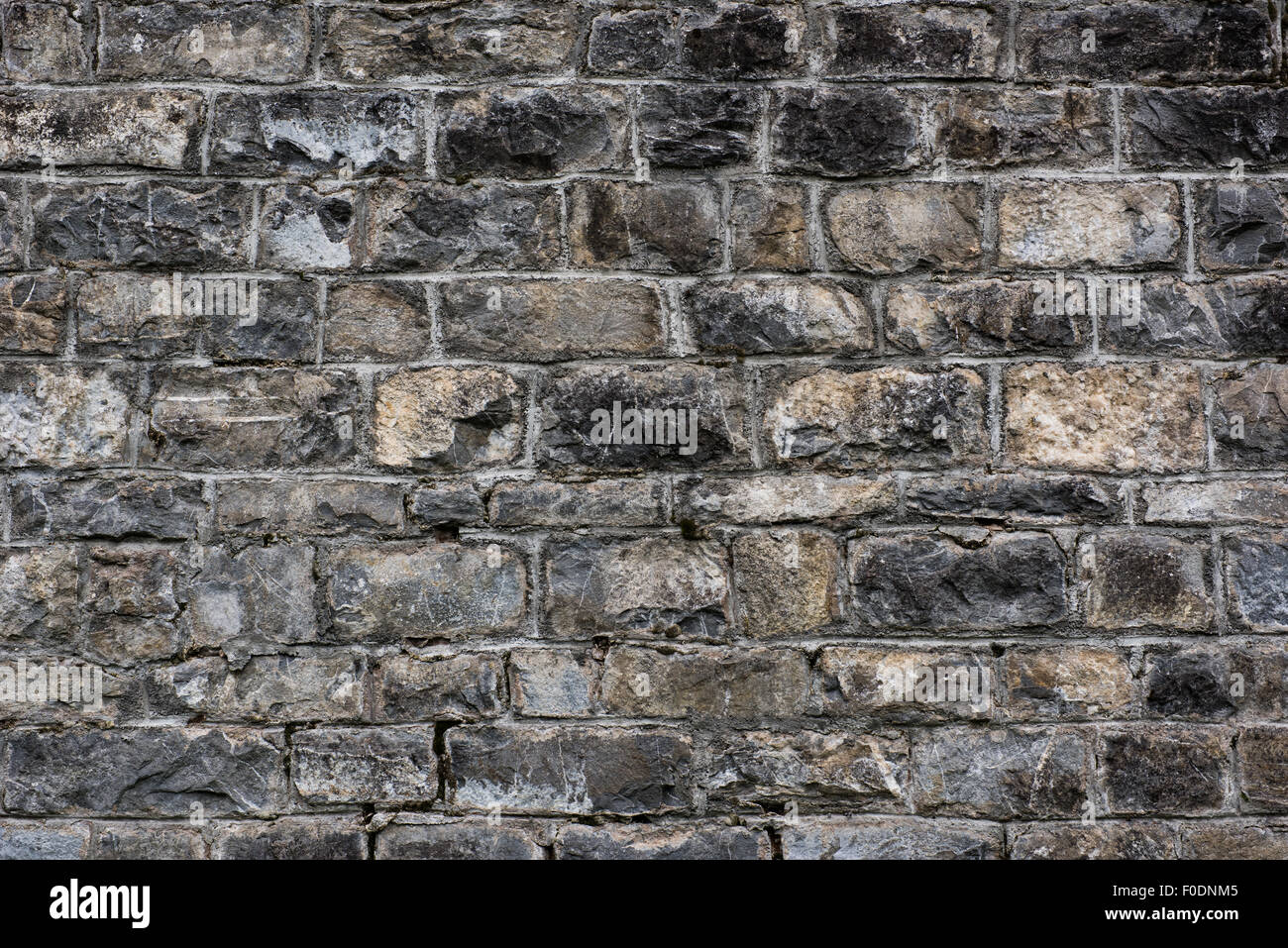 La texture du mur de pierre brute, personnalisable, adapté à l'utilisation d'arrière-plan. Banque D'Images