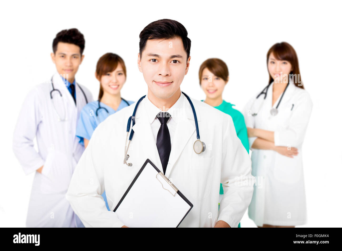 Smiling medical team Standing together isolated on white Banque D'Images