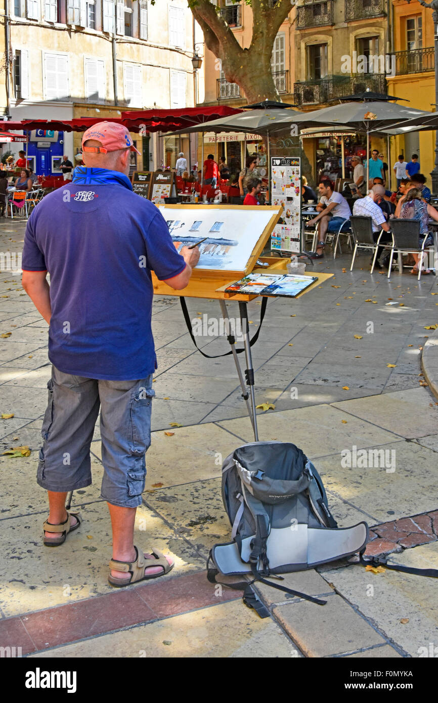 L'un d'un groupe d'artistes sur l'activité maison de vacances se sont réunis à la place de l'Hôtel de Ville pour créer des peintures de scènes locales Aix en Provence France Banque D'Images