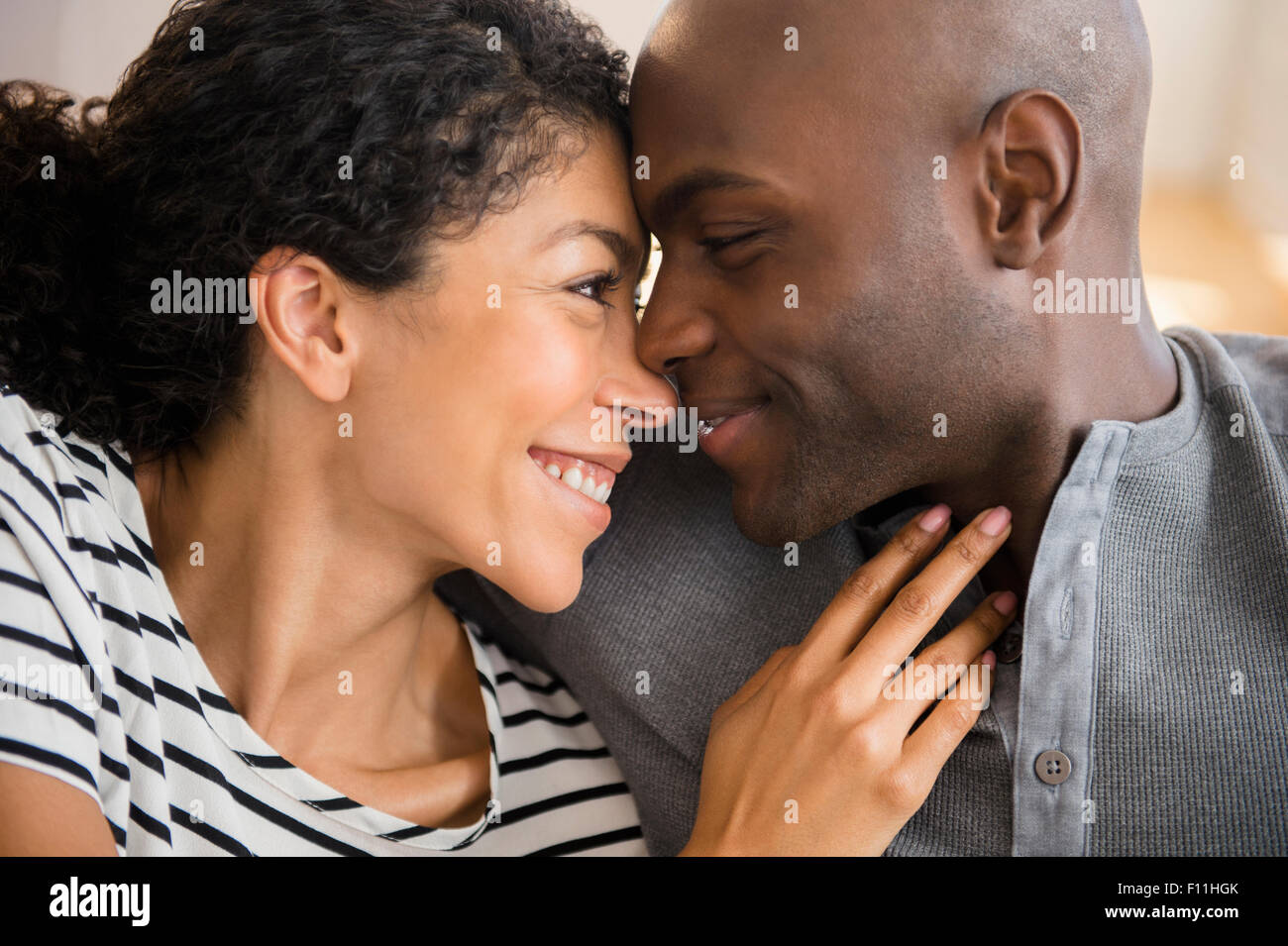 Close up of smiling woman rubbing noses Banque D'Images