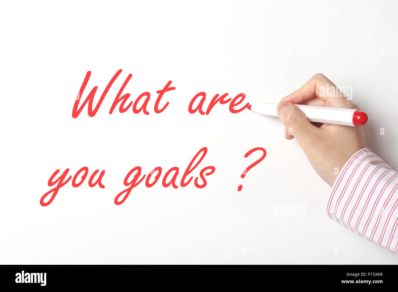 Femme d'affaires écrit quels sont vos objectifs mot sur tableau blanc Banque D'Images