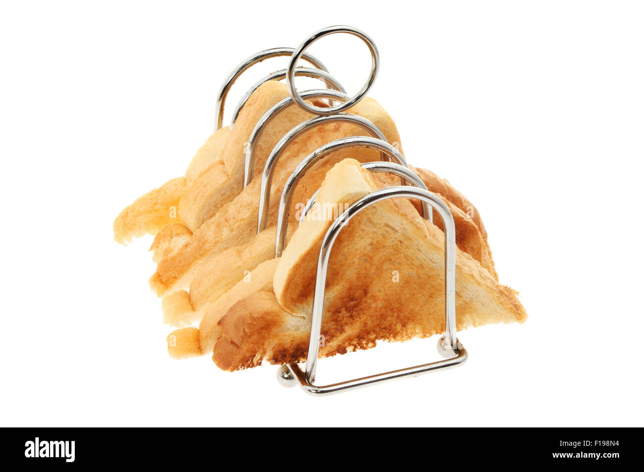 Tranches de pain grillé dans un rack toast blanc isolé contre Banque D'Images