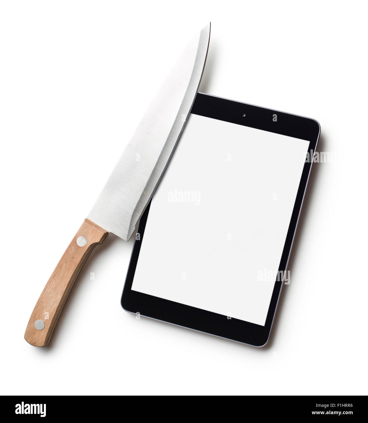 Tablette de l'ordinateur et le couteau sur fond blanc Banque D'Images