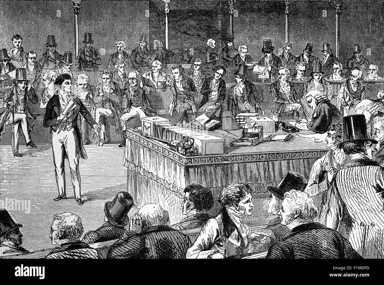 Lord John Russell, Whig anglais et politicien libéral, à la Chambre des communes britannique, présentant la Loi de réforme de 1832. Également connue sous le nom de loi de 1832 sur la représentation du peuple, c'est une loi du Parlement du Royaume-Uni qui a apporté des changements majeurs au système électoral de l'Angleterre et du pays de Galles. Il abolit de minuscules districts, donnait la représentation aux villes, donnait le vote aux petits propriétaires fonciers, aux agriculteurs locataires, aux commerçants, à certains propriétaires et à certains locataires, mais seuls les hommes qualifiés pouvaient voter. Banque D'Images