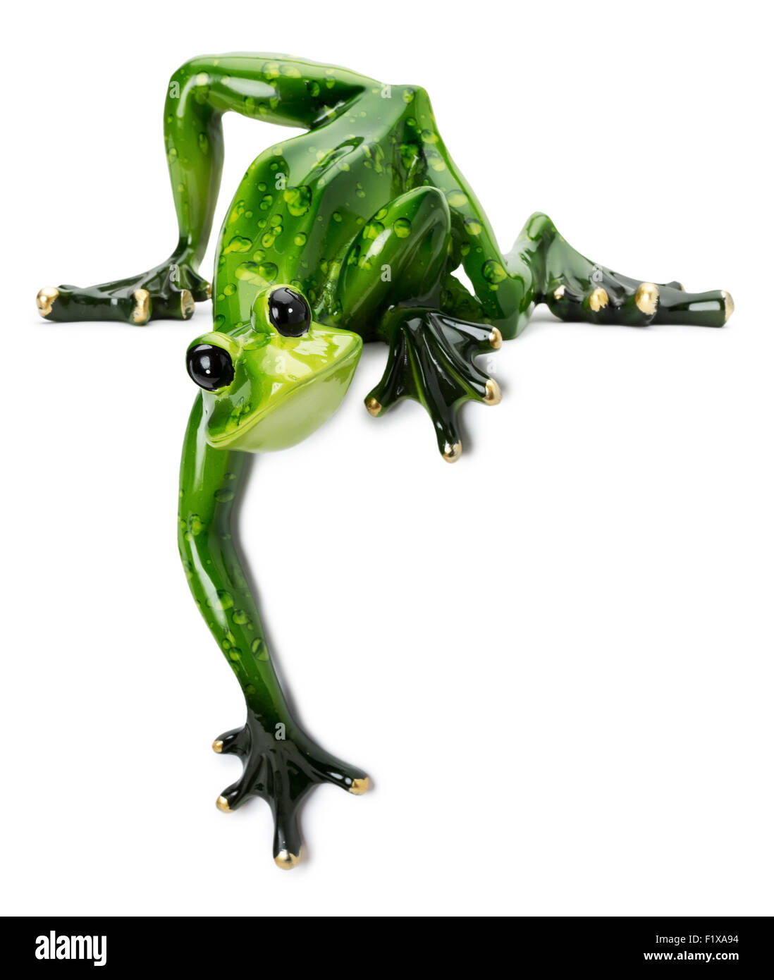 Statue de grenouille verte sur le fond blanc. Banque D'Images