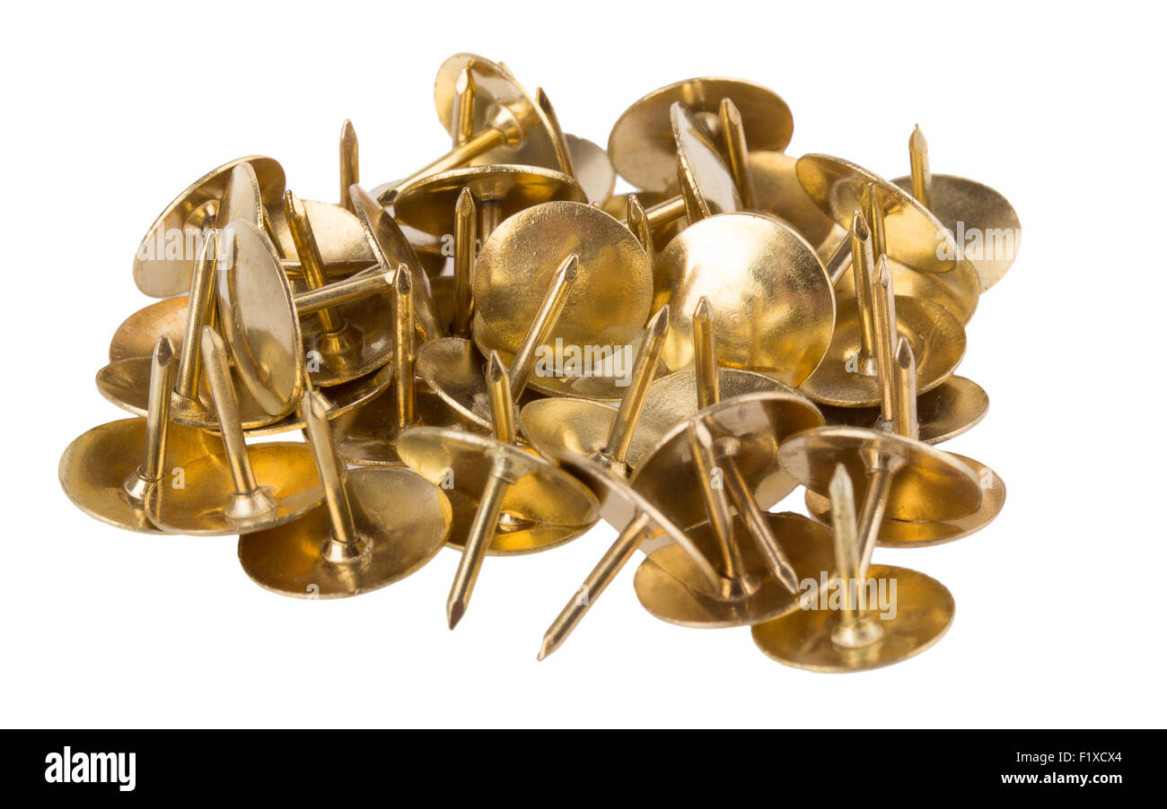 Les clous d'or sur un fond blanc. Banque D'Images