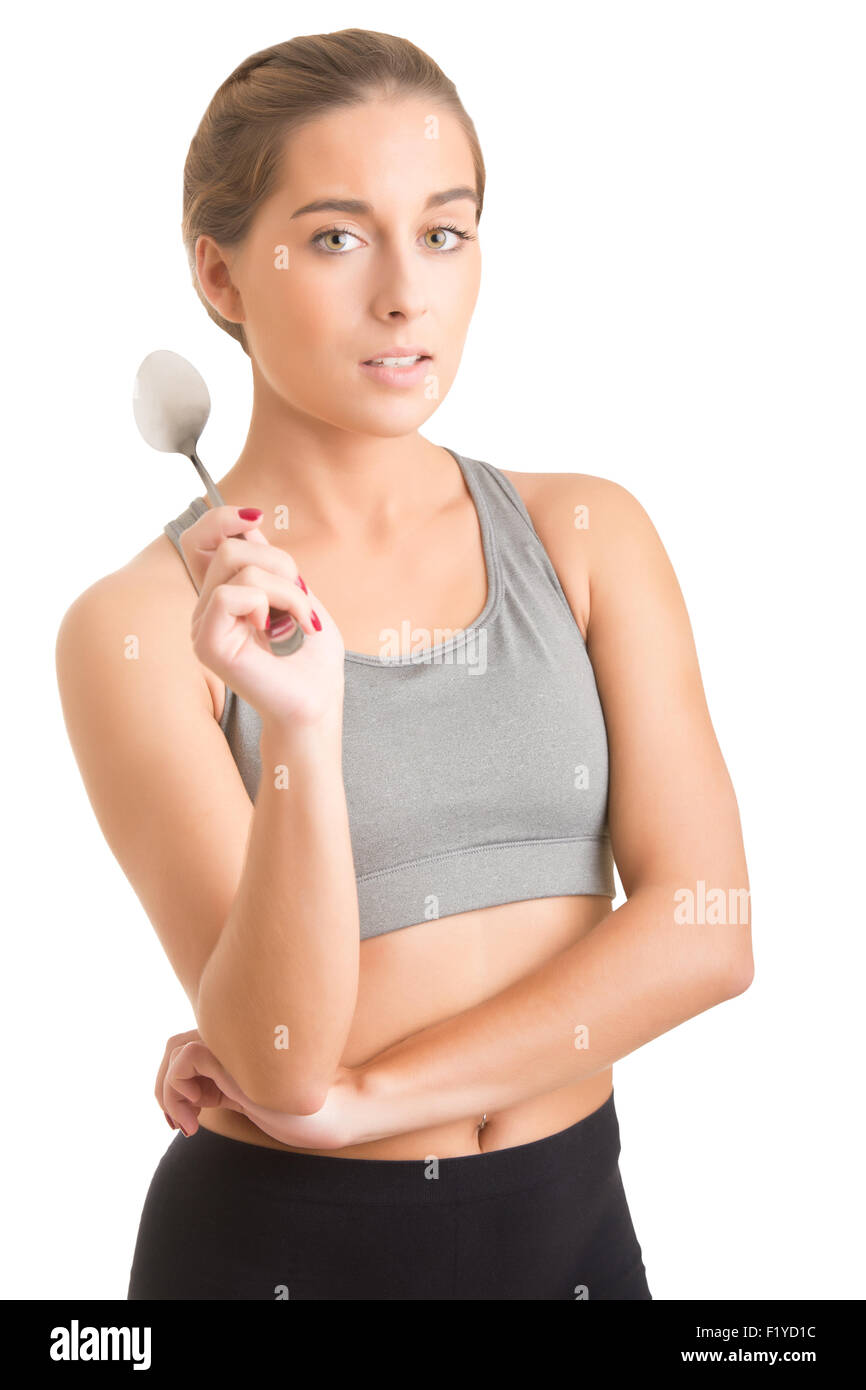 Mettre en place les plus sportifs woman holding une cuillère de blanc isolé Banque D'Images