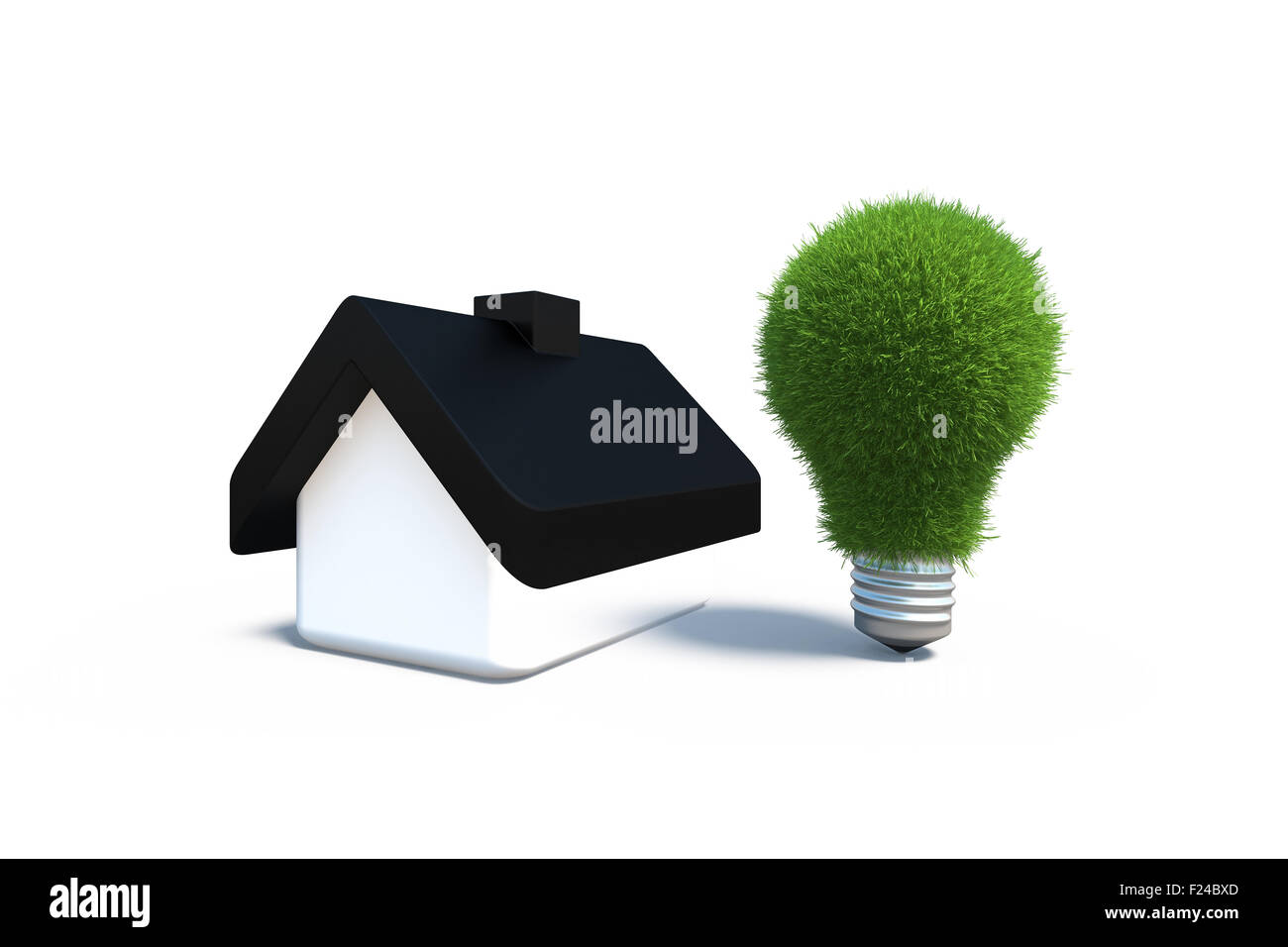 Petite maison avec une lampe verte symbolisant la conservation de l'énergie Banque D'Images
