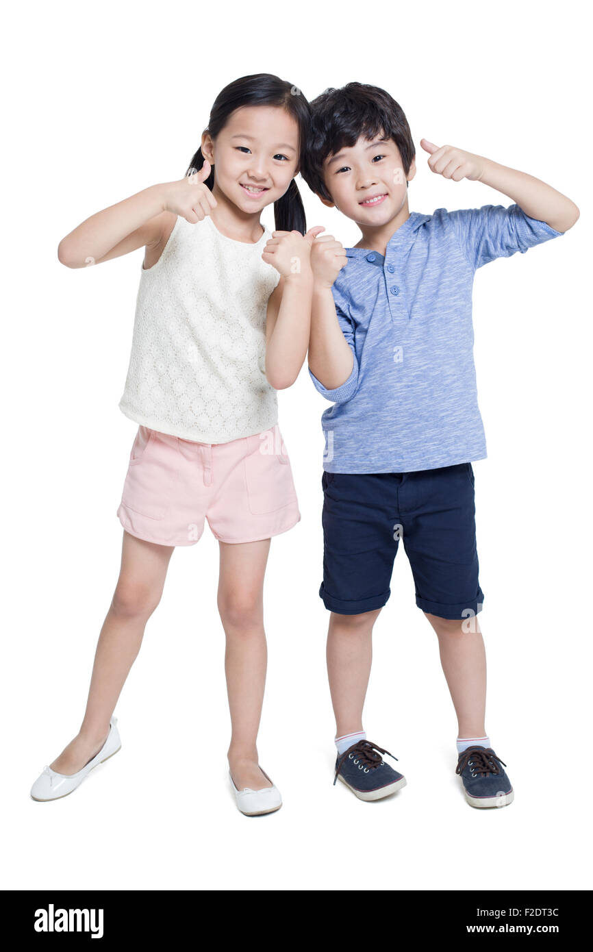 Heureux enfants faire Thumbs up Banque D'Images