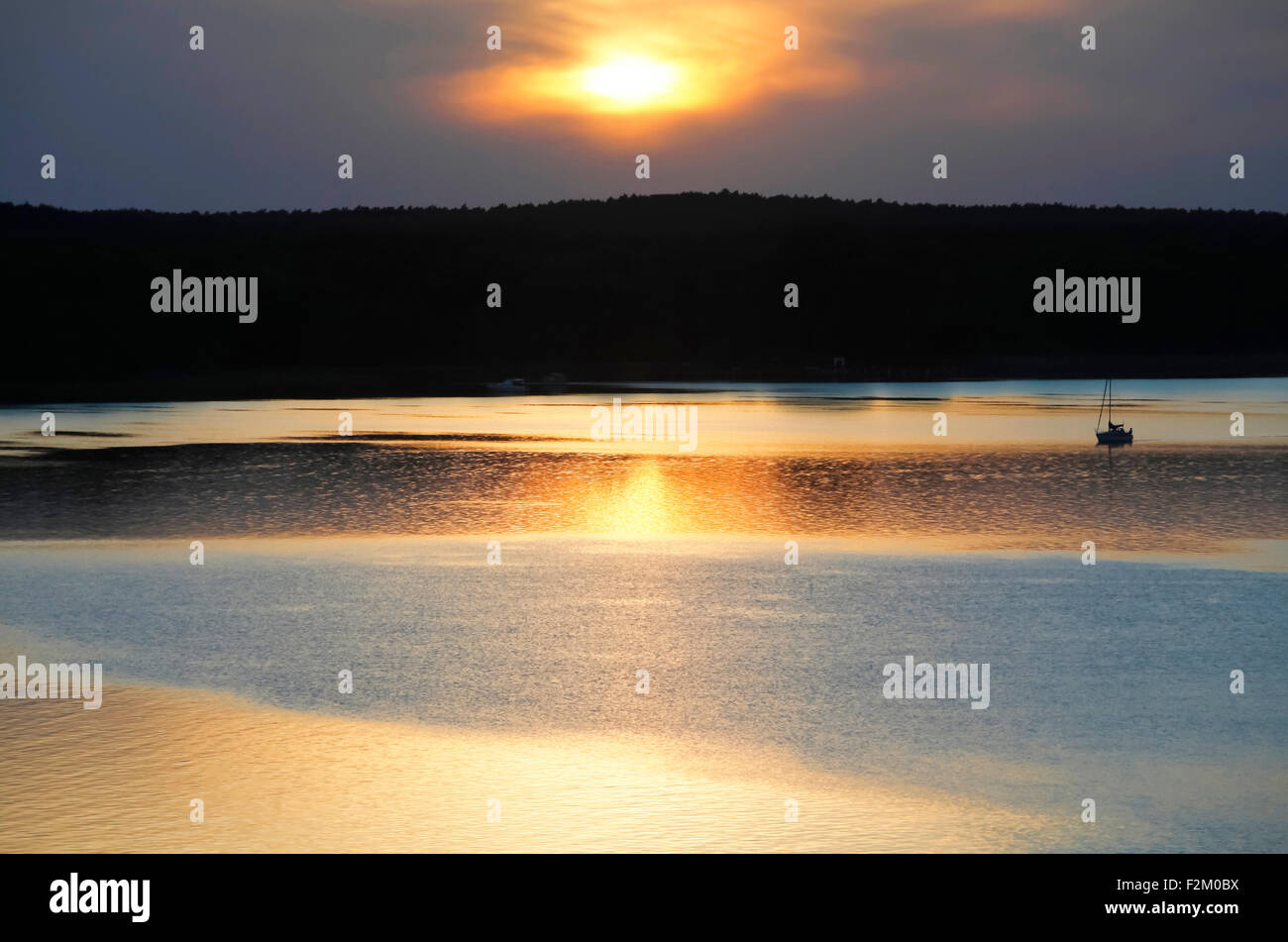 Allemagne, Brandebourg, Scharmuetzel le lac au coucher du soleil Banque D'Images