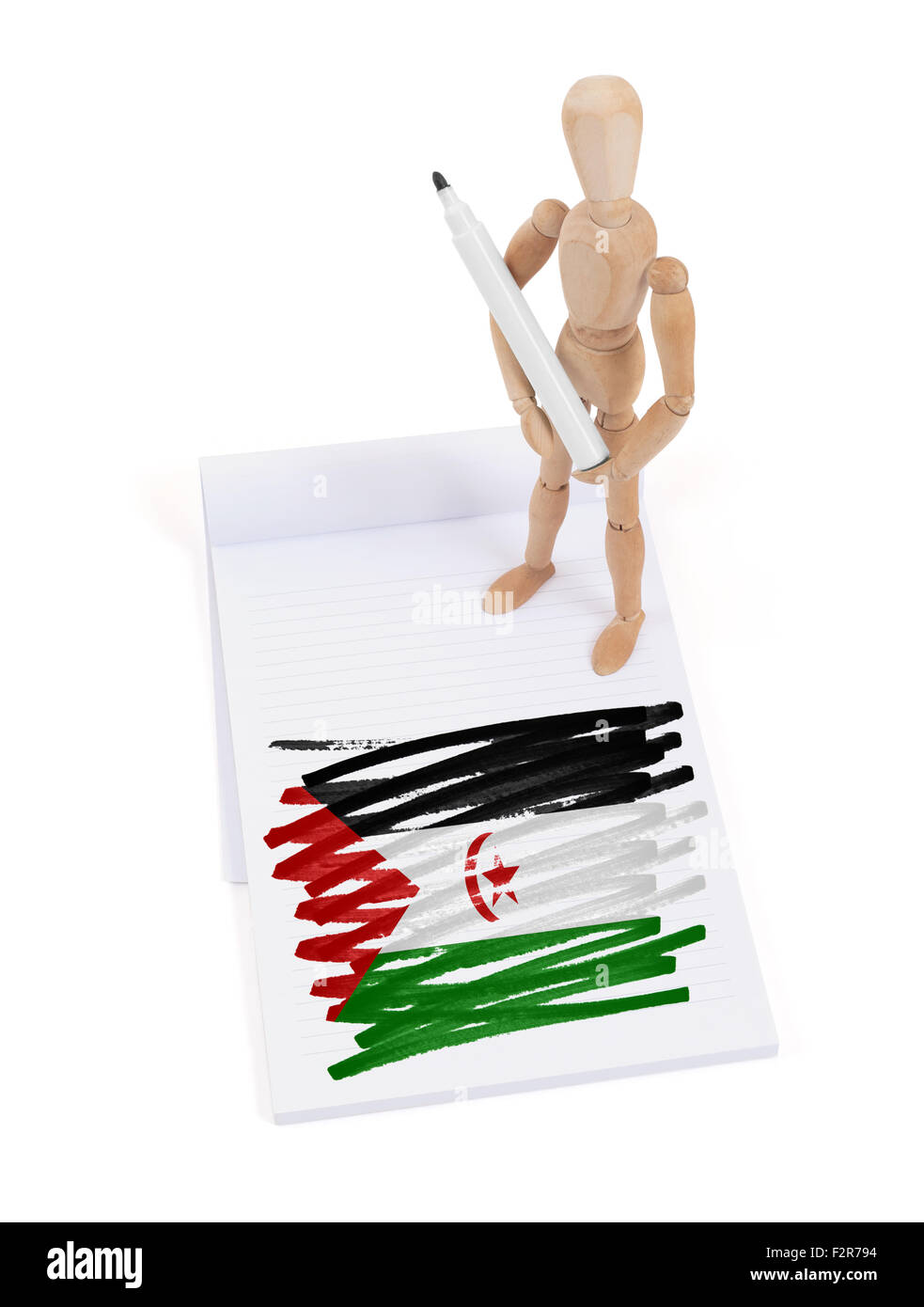 Mannequin en bois fait un dessin d'un drapeau - Sahara Occidental Banque D'Images