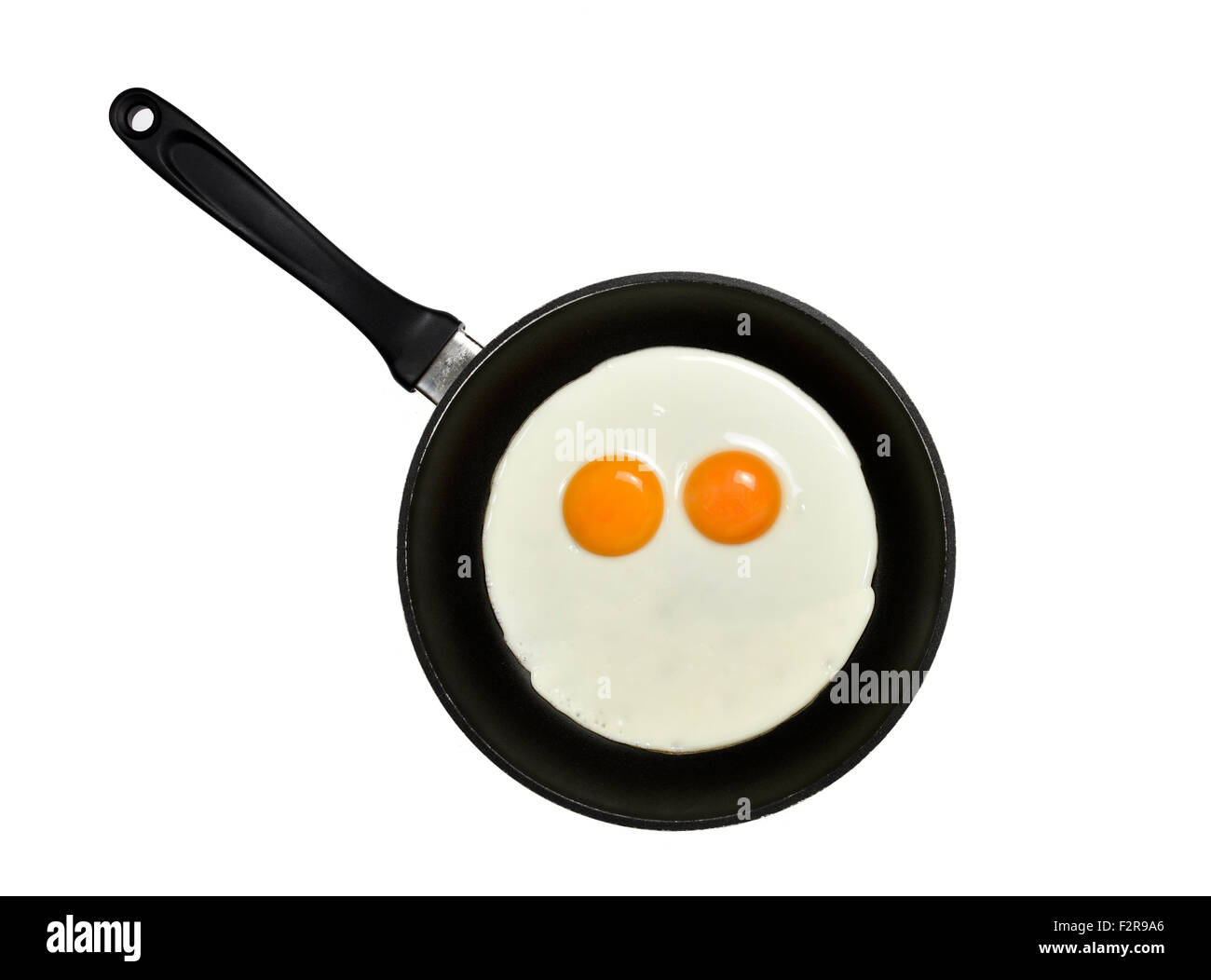 Les œufs dans une casserole, faire face avec les yeux Banque D'Images