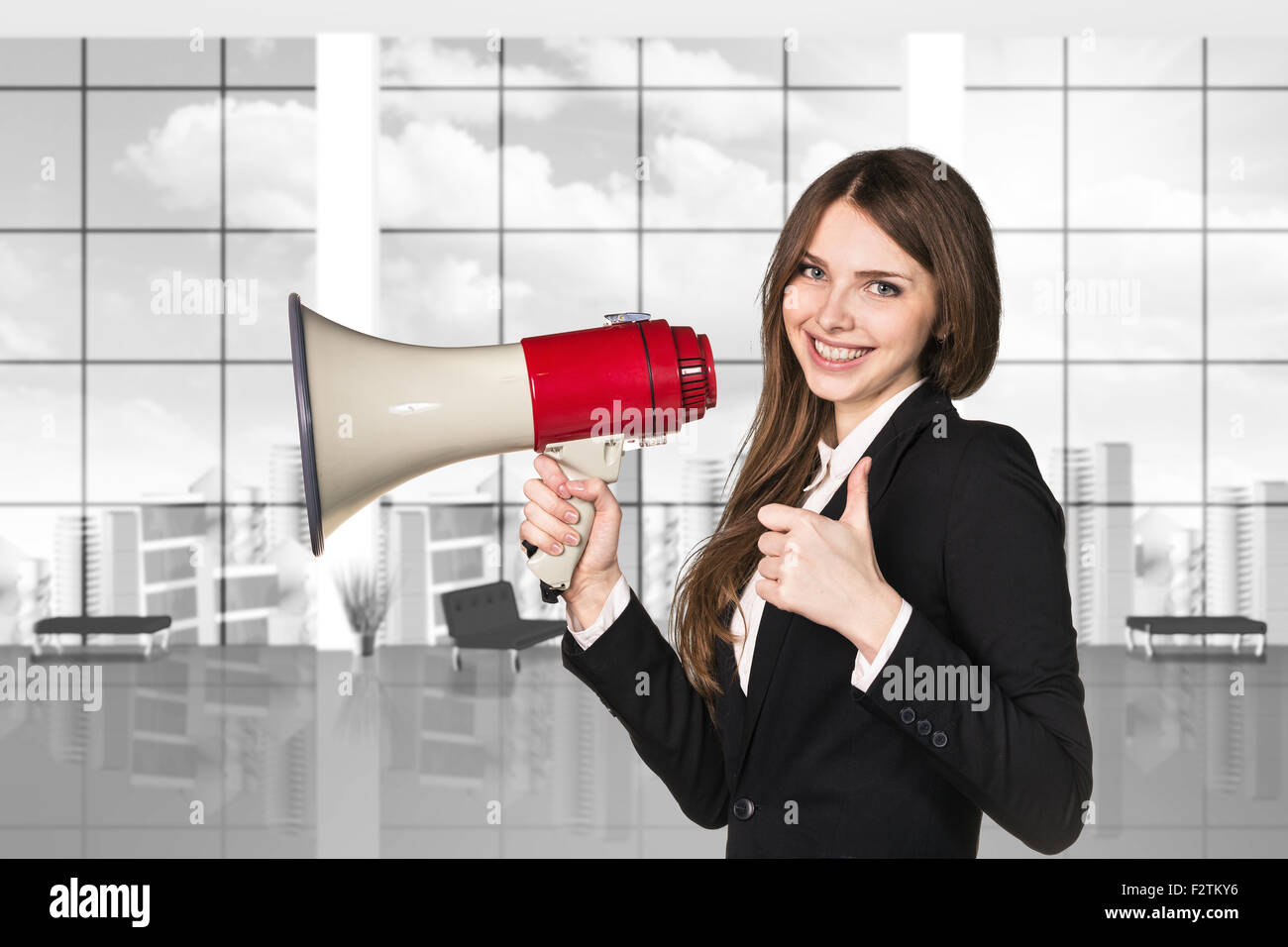 Businesswoman with megaphone et Thumbs up Banque D'Images
